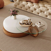 Round coffee table with glass top and solid wood legs, perfect for modern living rooms